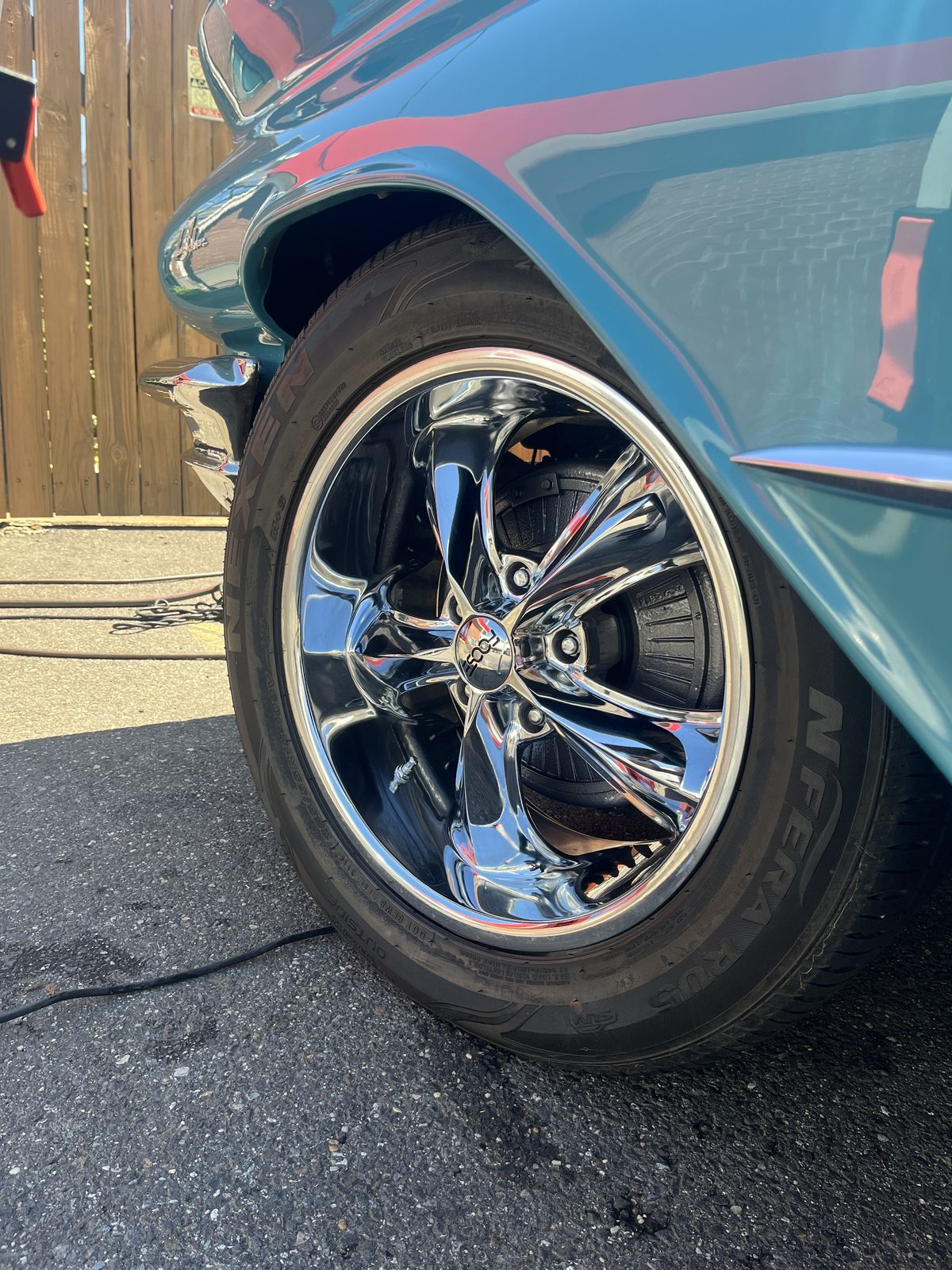 Detailed chrome wheel on a classic Buick LeSabre