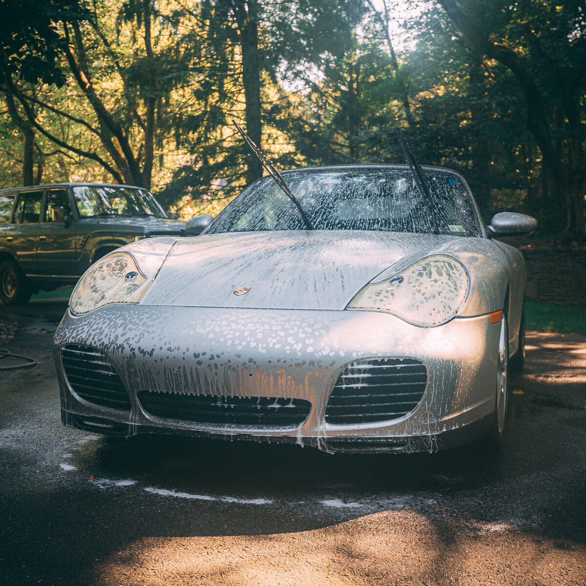 Porsche covered in foam during a mobile detailing wash